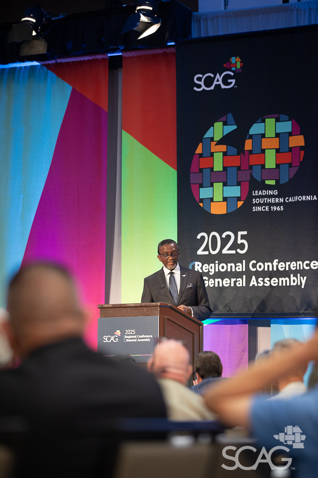 SCAG Executive Director Kome Ajise speaking from the podium. 