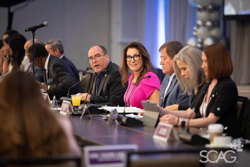 SCAG Regional Council engaged in discussion.